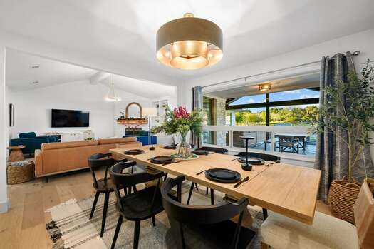 Dining area with wooden table and seating for eight
