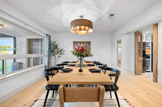 Dining area with wooden table and seating for eight