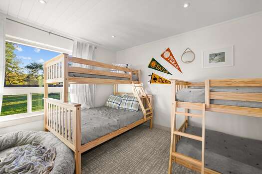 Bunk room with two sets of twin over full bunk beds
