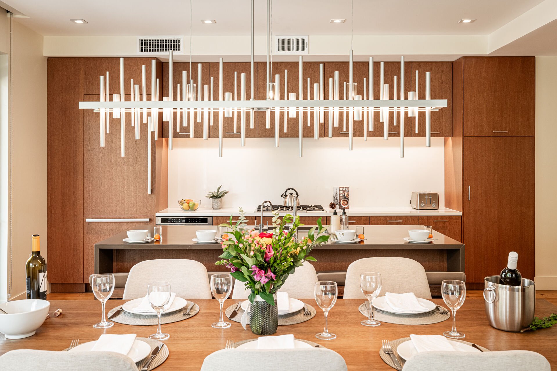 Lit by contemporary styled chandelier