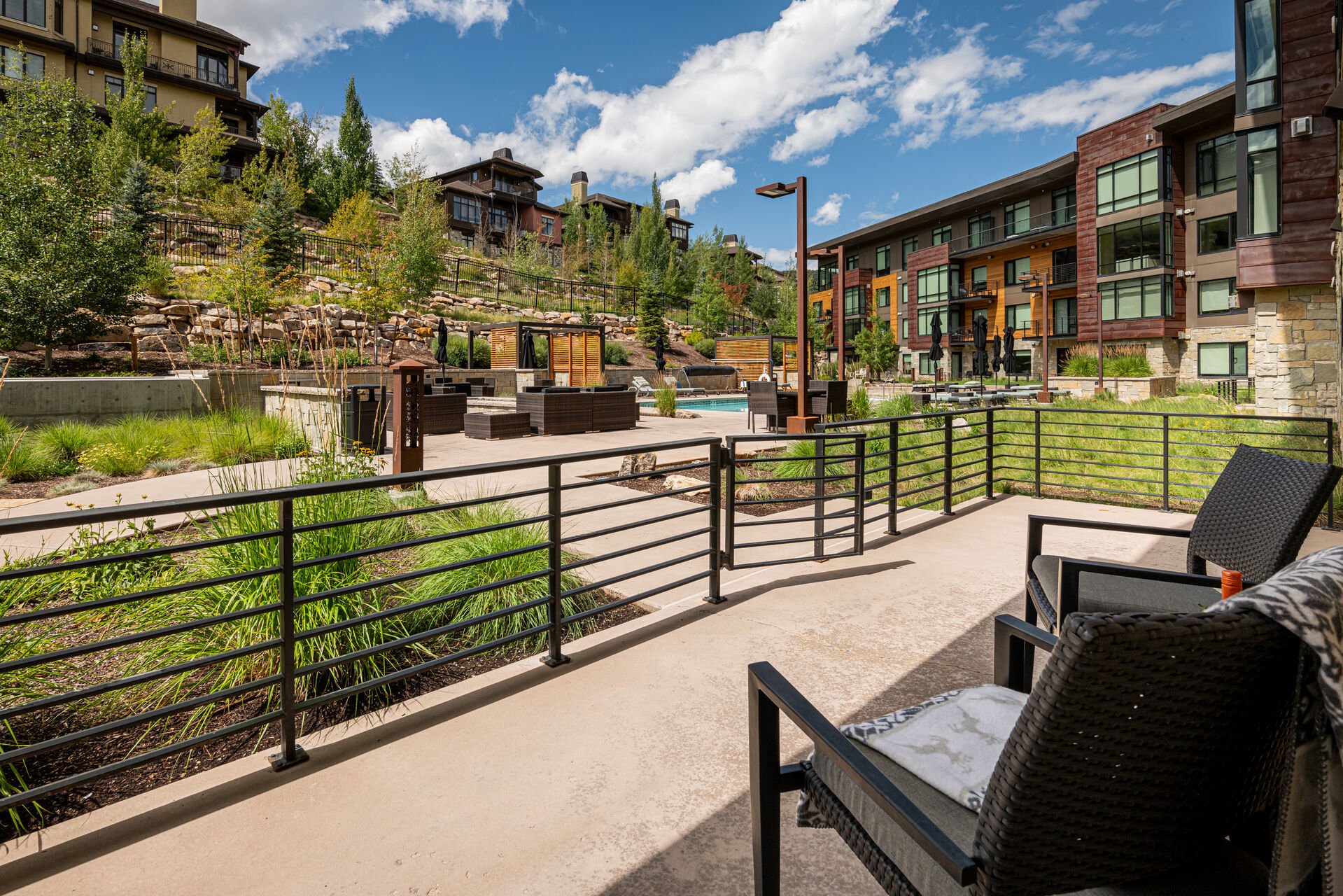 Lift 301's private patio features direct access to community pool areas