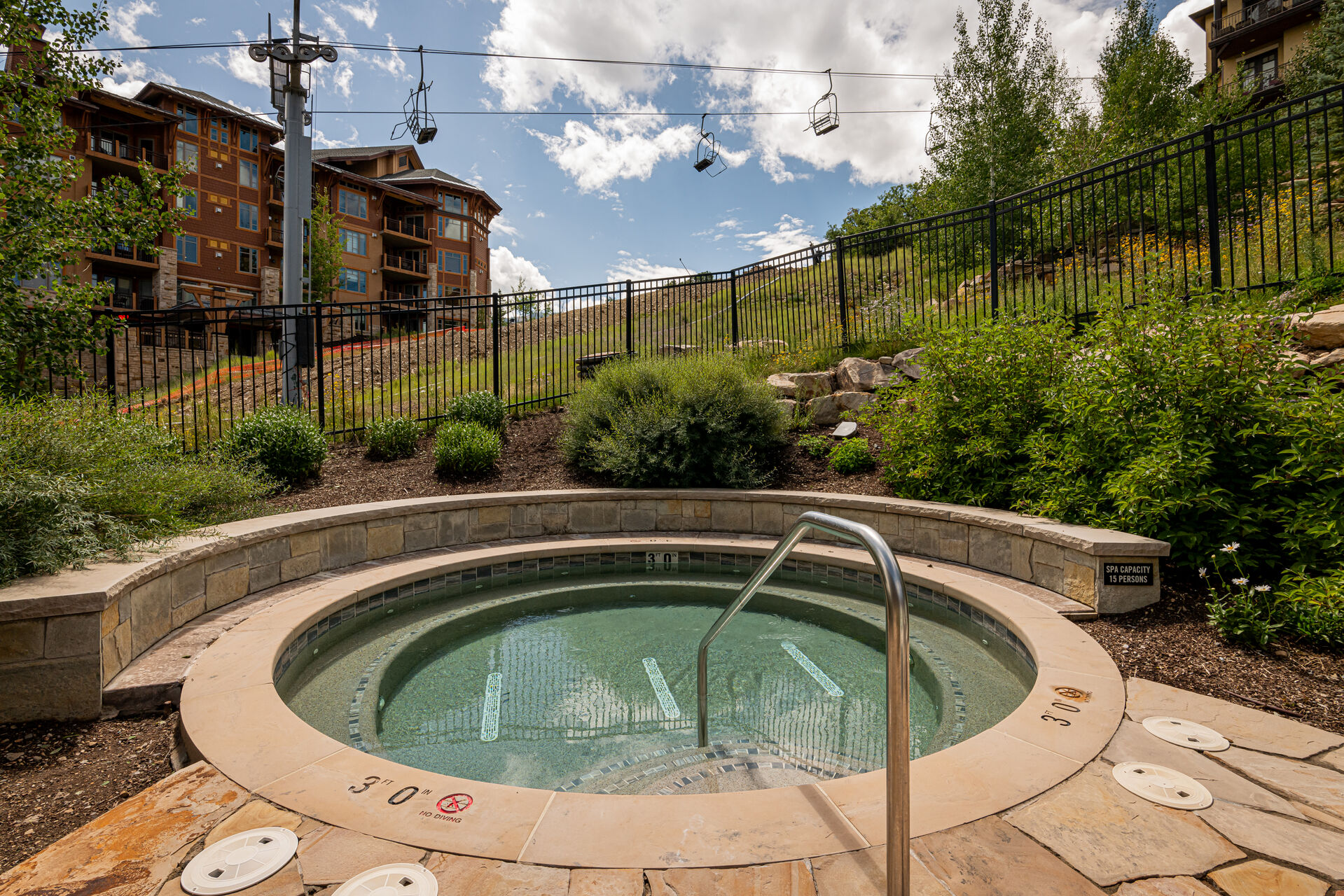 Two community hot tubs open year round with views of the slope
