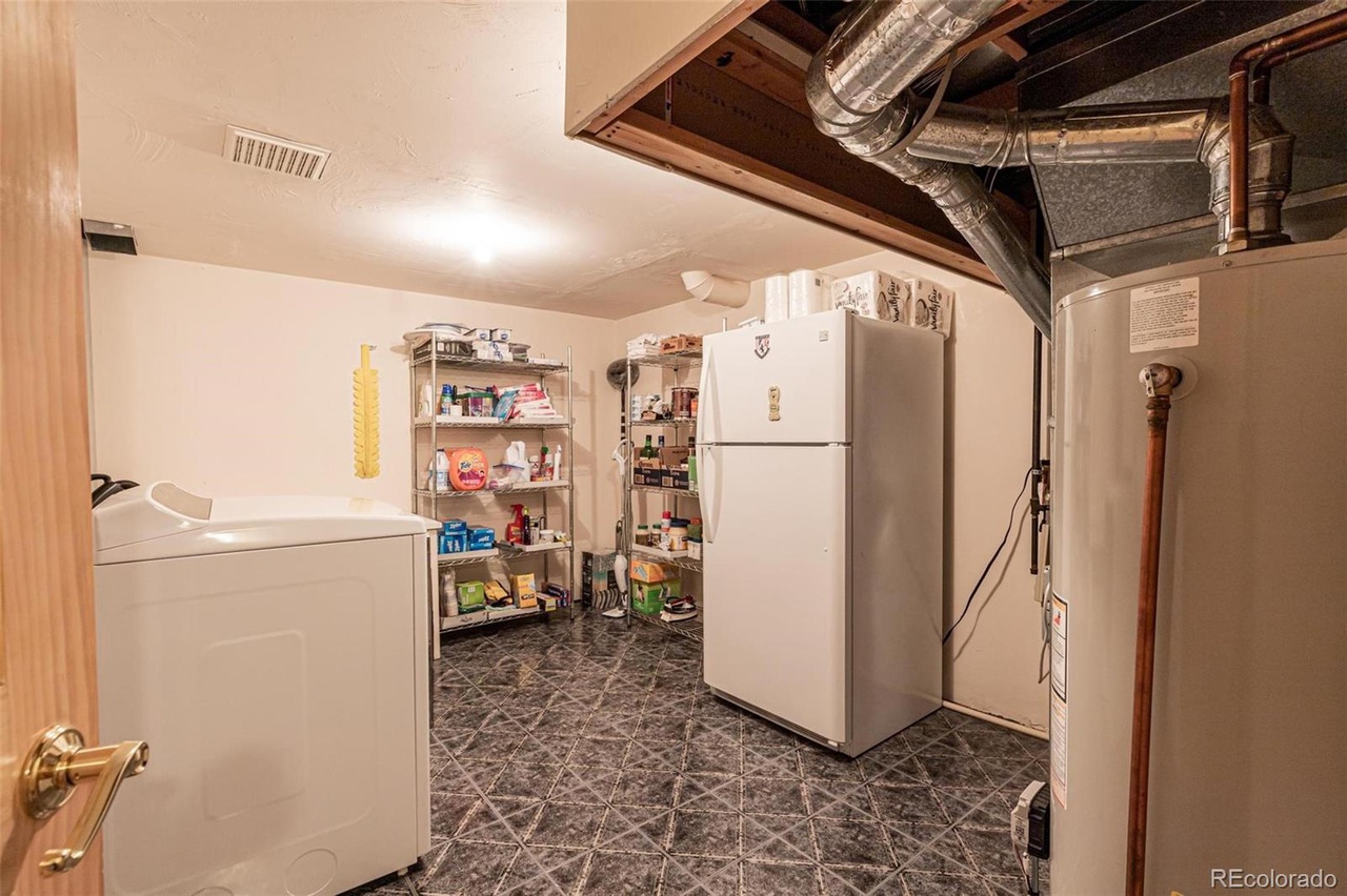 Extra Full Size Refrigerator in the Utility Room.