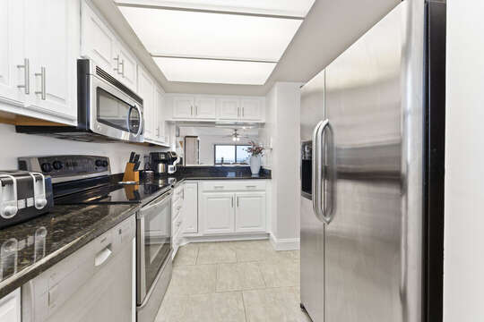 Step into a fully equipped kitchen designed to meet your basic cooking needs.