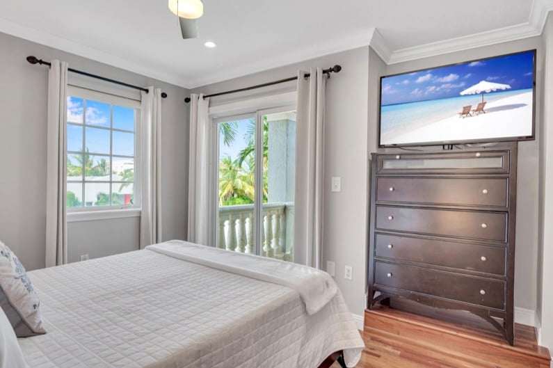 Drift into dreams with a view of the ocean's embrace. Wake up refreshed in our queen bedroom, where stunning ocean vistas meet modern comfort, complete with a smart TV for leisurely moments. Experience serenity on every level.