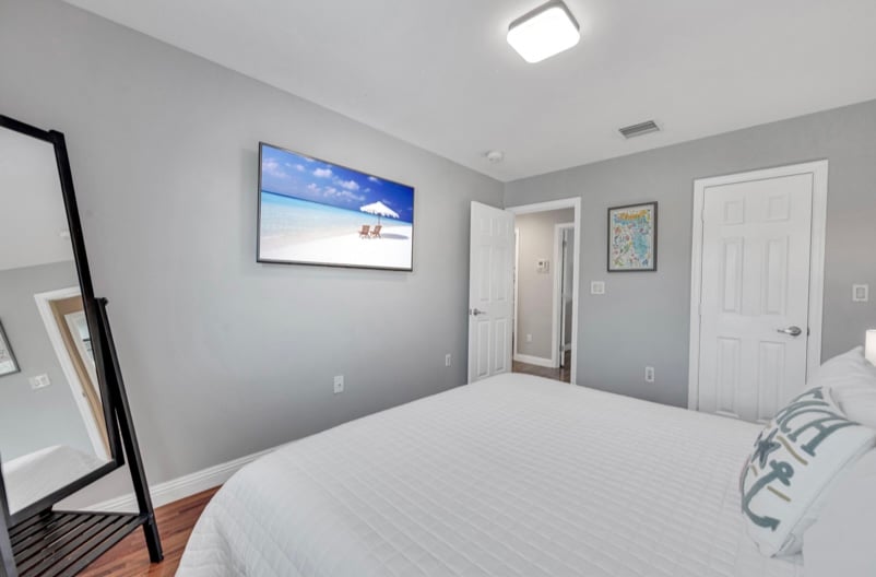 The third bedroom features a king bed and smart TV.