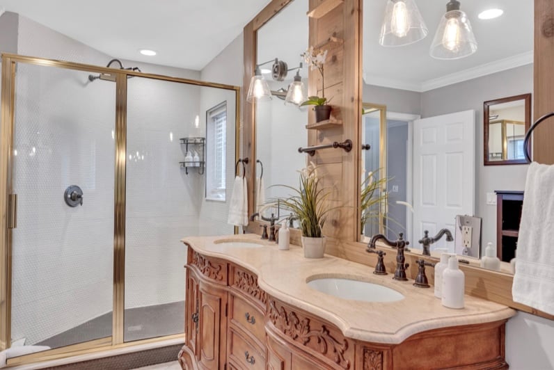 Indulge in self-care in our primary bathroom oasis. Experience the ultimate convenience of a double vanity, the luxury of a walk-in shower, and the tranquility of a soaking tub. Pamper yourself in style and comfort.