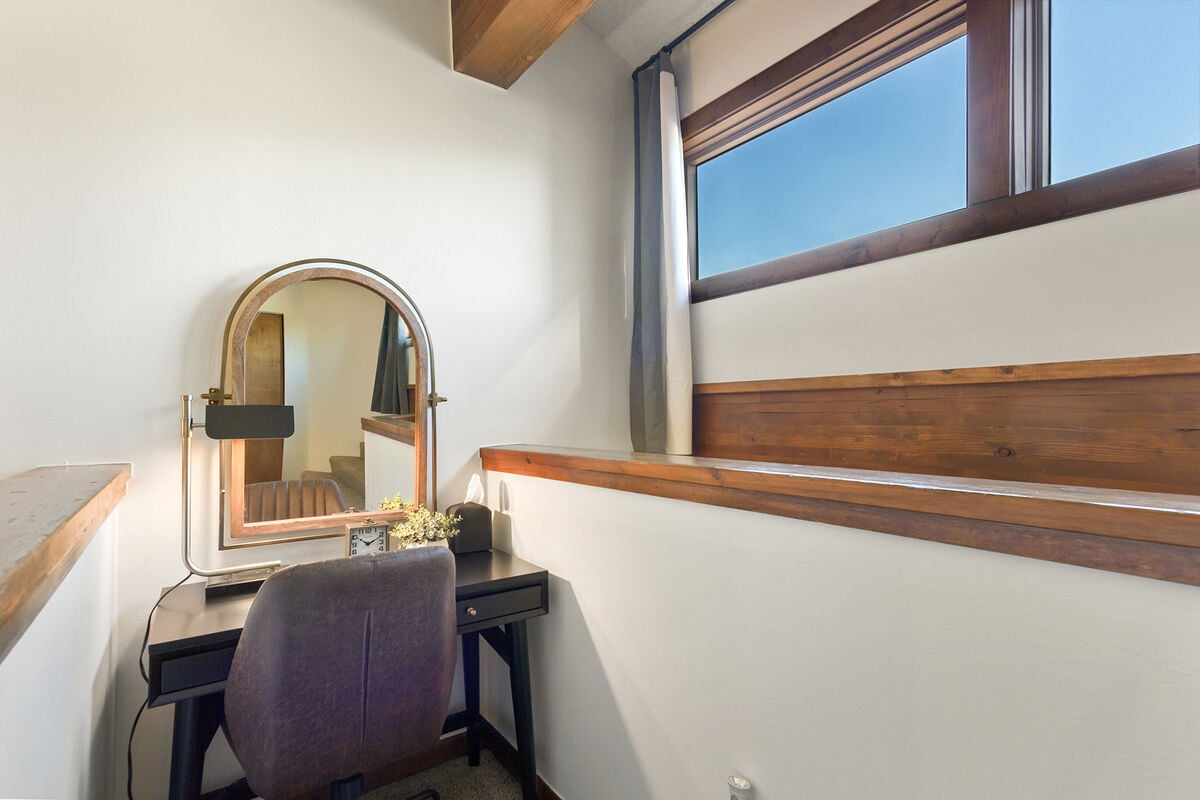 Adorable Desk in King Loft Bedroom: The King Loft Bedroom has an adorable desk that also serves as a makeup station, ensuring you look your best before exploring the town  