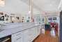 Brightly lit, open concept living/dining/kitchen area