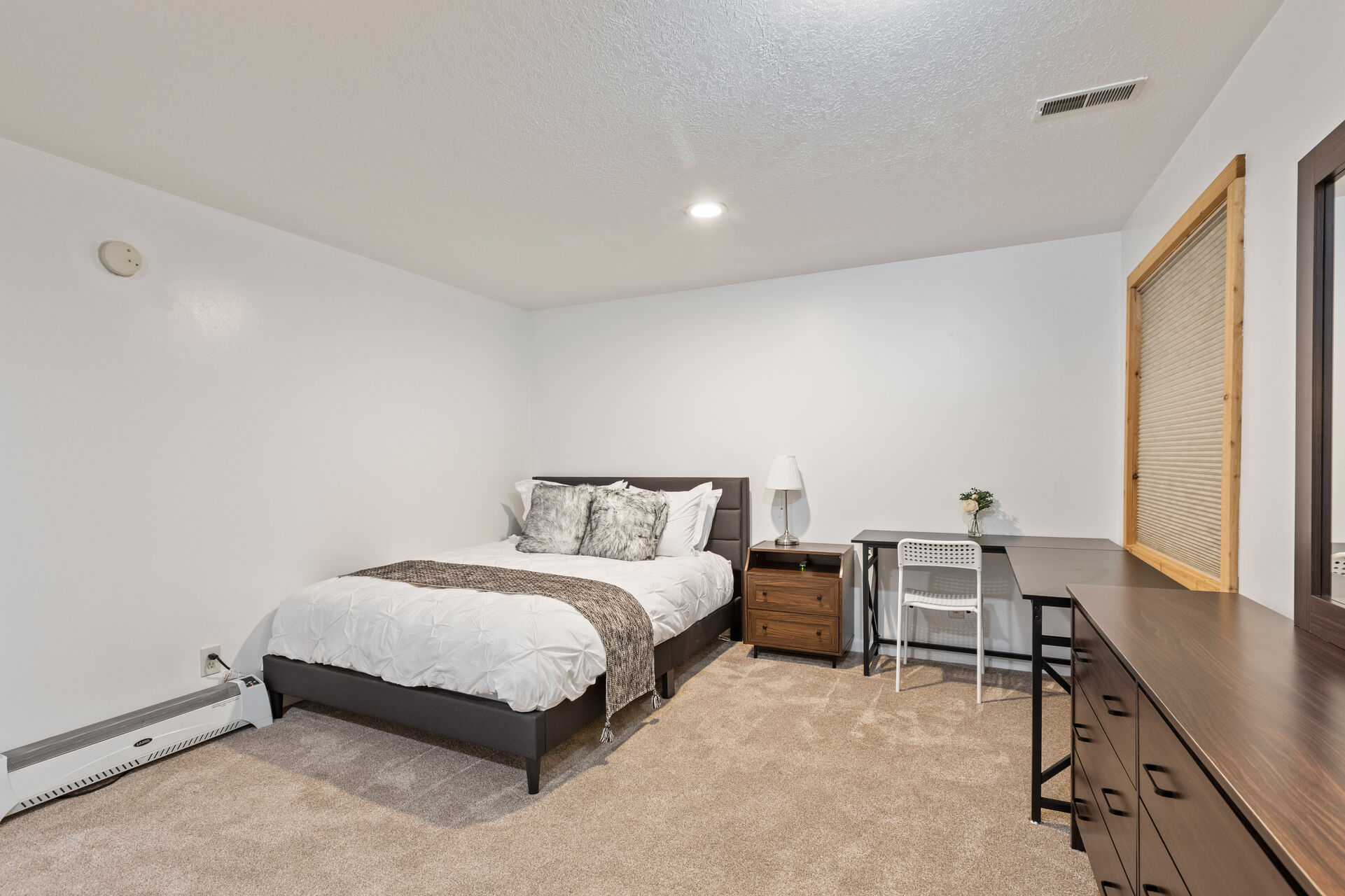 Lower level Bedroom 4 with a queen bed