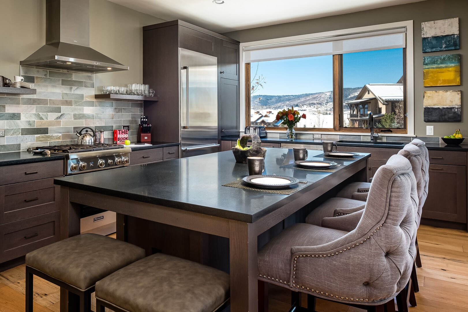 The spacious kitchen island with a view of Emerald Mountain and over the top sunsets.