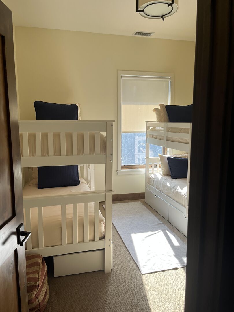 Downstairs bunk room, four twin beds.