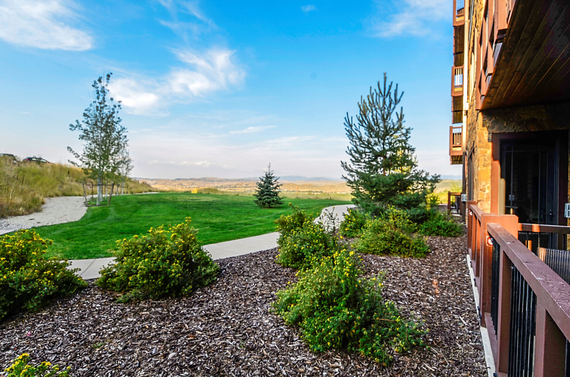 This unit doe not face another building so you get open views out onto the grassy yard area overlooking Utah mountains in the distance.