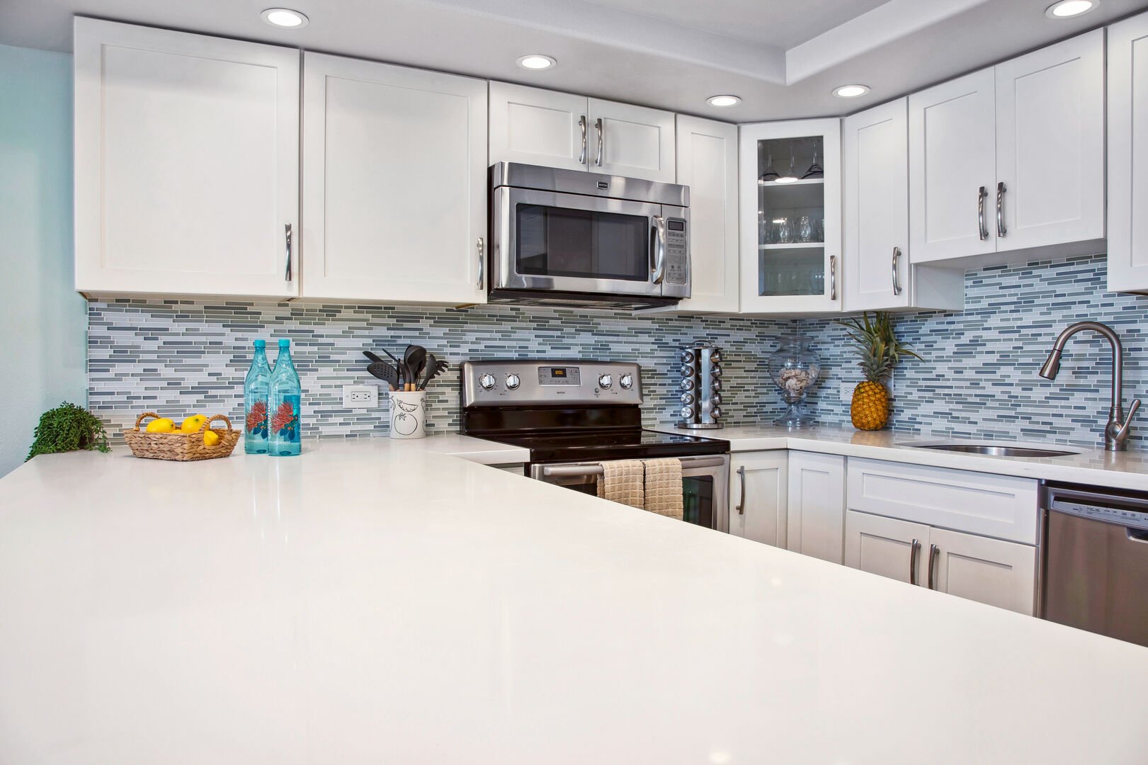 Fully equipped kitchen with countertop, and full-size appliances.