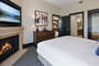 Master Bedroom with fireplace TV and HDTV