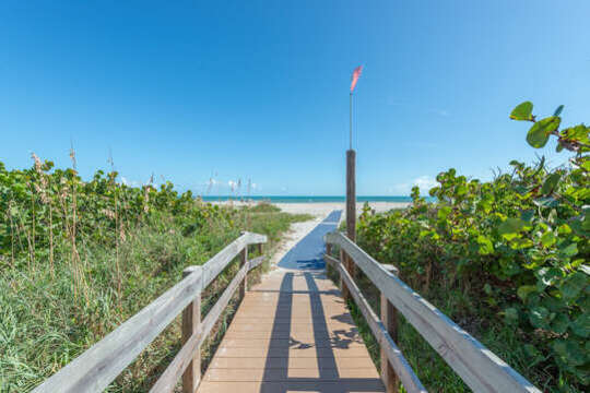 Embrace the convenience of a short walk to the beautiful beach.