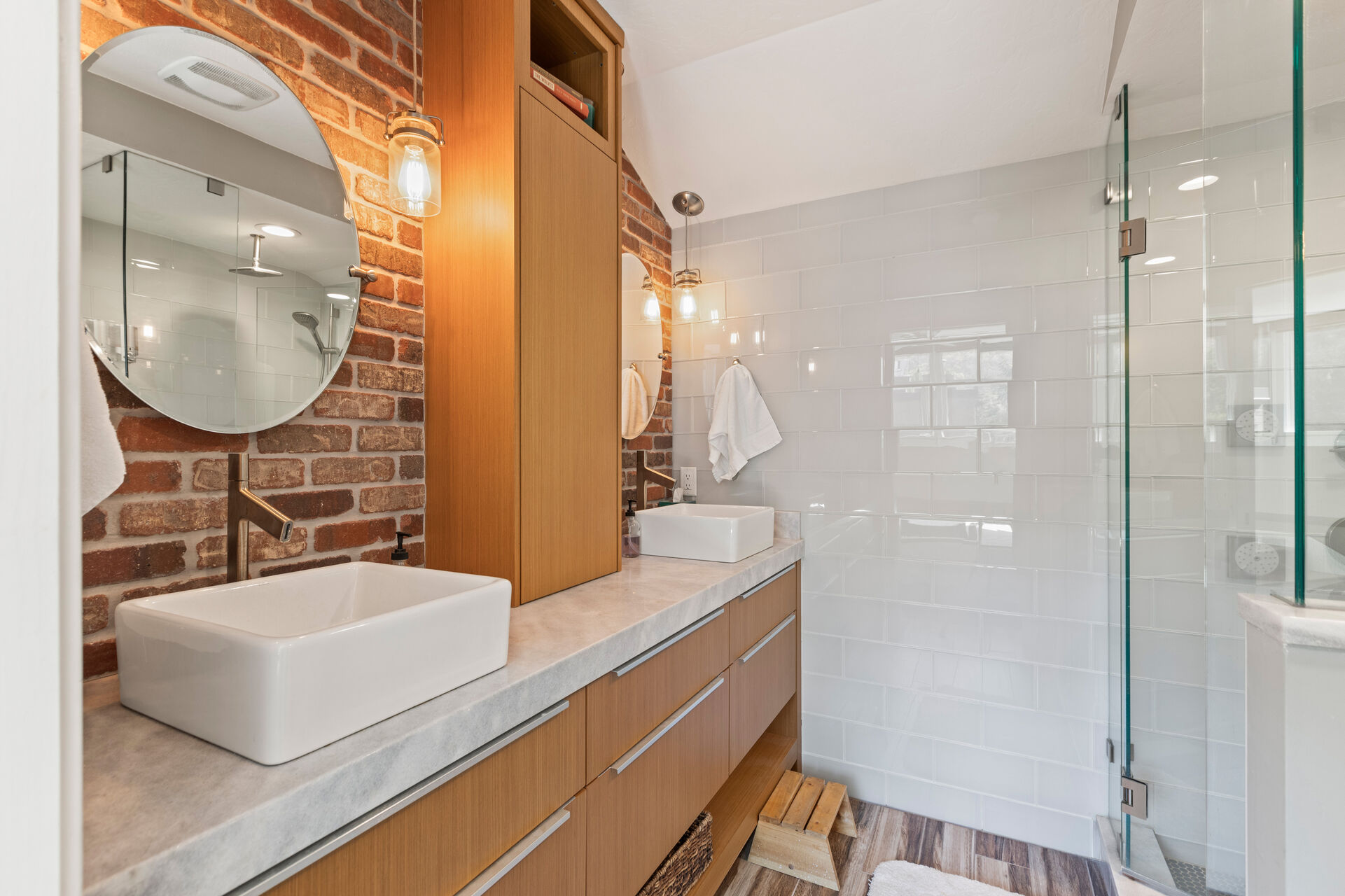 En Suite with two sinks and a tile/glass shower