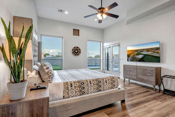 Master Bedroom with King Bed, Smart TV, Automatic Window Blinds and Access to Backyard