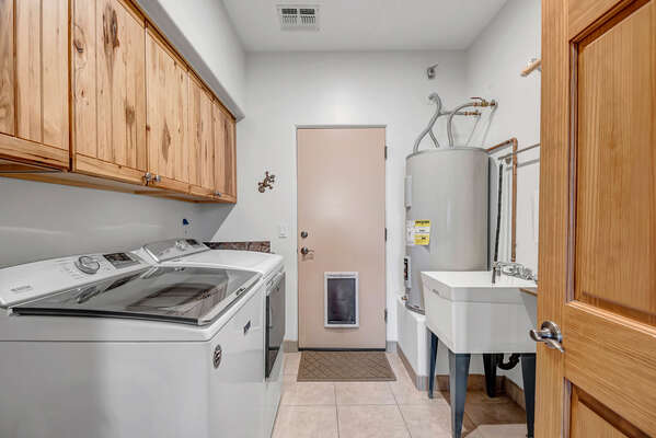 Laundry Room with Utility Sink and Full Size Washer and Dryer