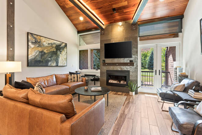 Contemporary leather furnishings and a gas fireplace