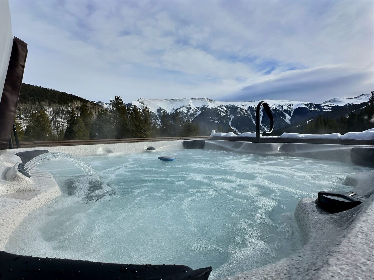 Soak in our hot tub while soaking up the breathtaking mountain vistas, an ideal way to relax and enjoy the natural beauty.
