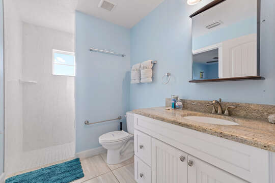 Guest bathroom with walk-in shower.