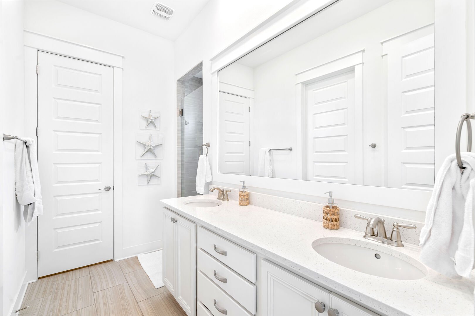 Primary bathroom features a large walk-in closet and large shower