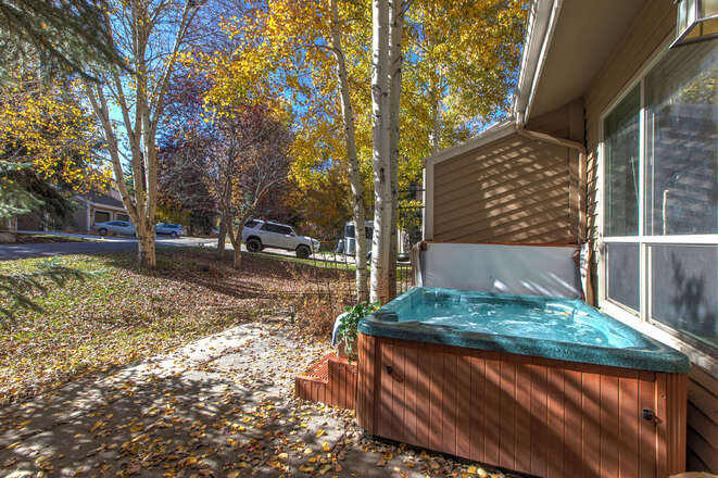 Spacious yard and patio with a private hot tub
