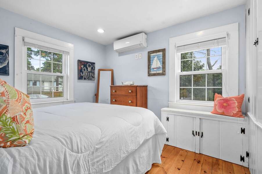 Beatifully lit first bedroom with queen bed, window seat, and full closet- 135 Pine Knoll Avenue Chatham Cape Cod - Sarah-N-Dipity - NEVR