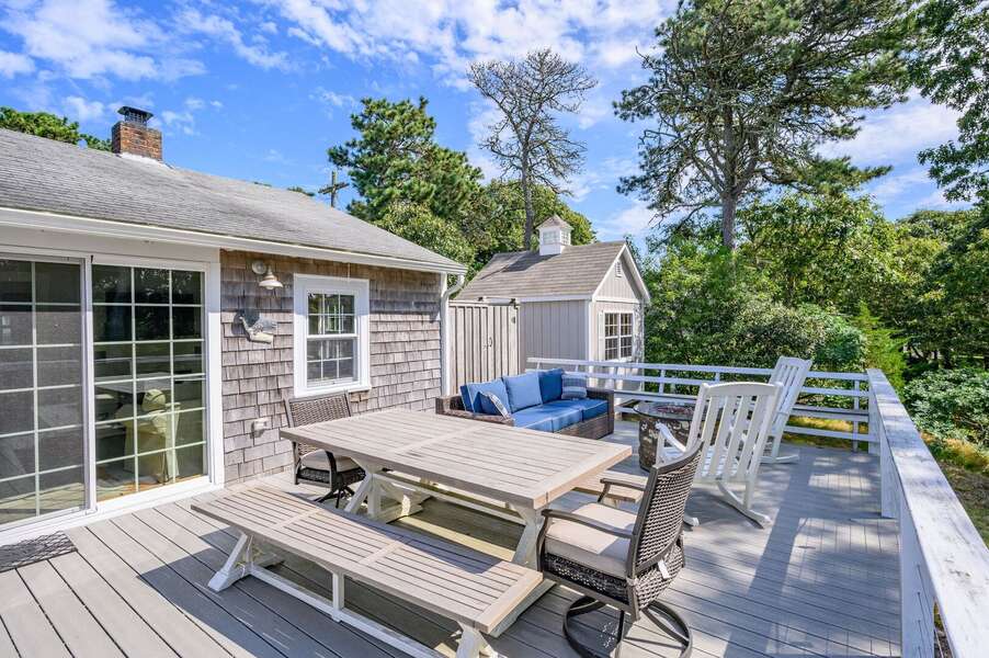 Outdoor dining overlooking the marsh at 135 Pine Knoll Avenue Chatham Cape Cod - Sara-N-Dipity - NEVR