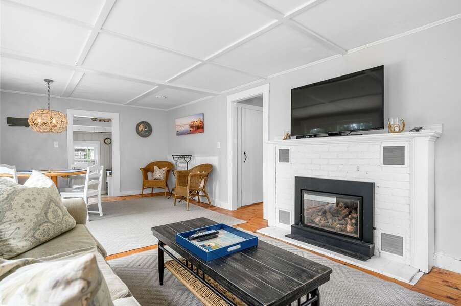 Open living-dining area with gas fireplace 135 Pine Knoll Avenue Chatham Cape Cod - Sarah-N-Dipity - NEVR