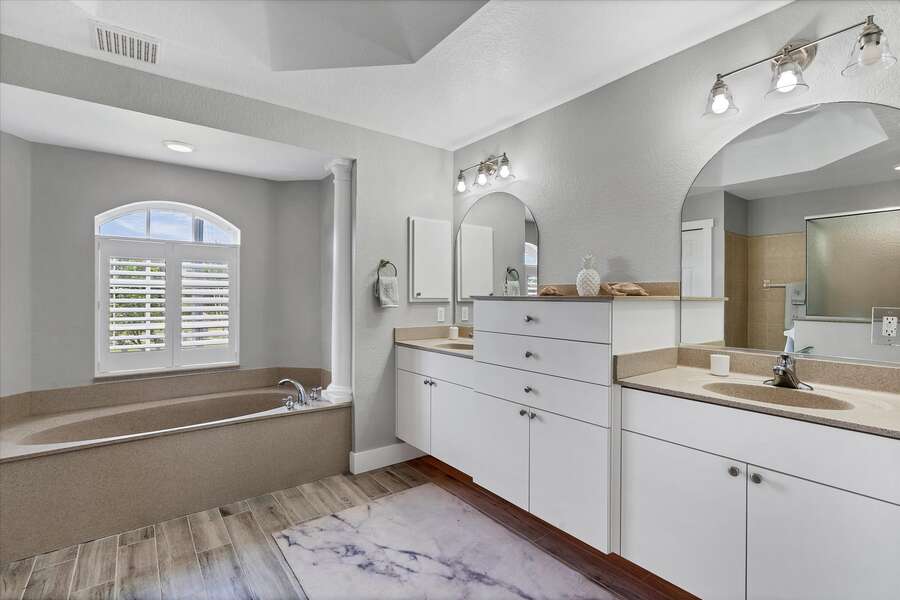 Primary bathroom with double sinks and soaking tub