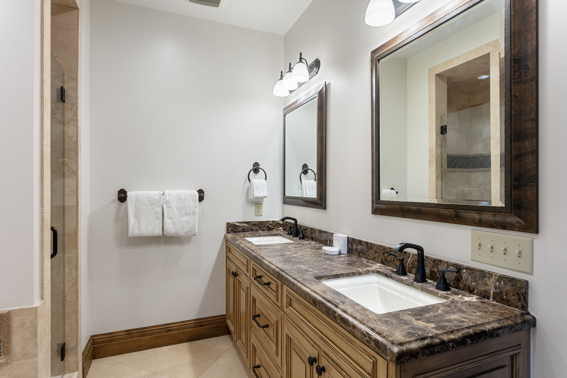 Master bedroom ensuite bathroom with dual vanity sinks