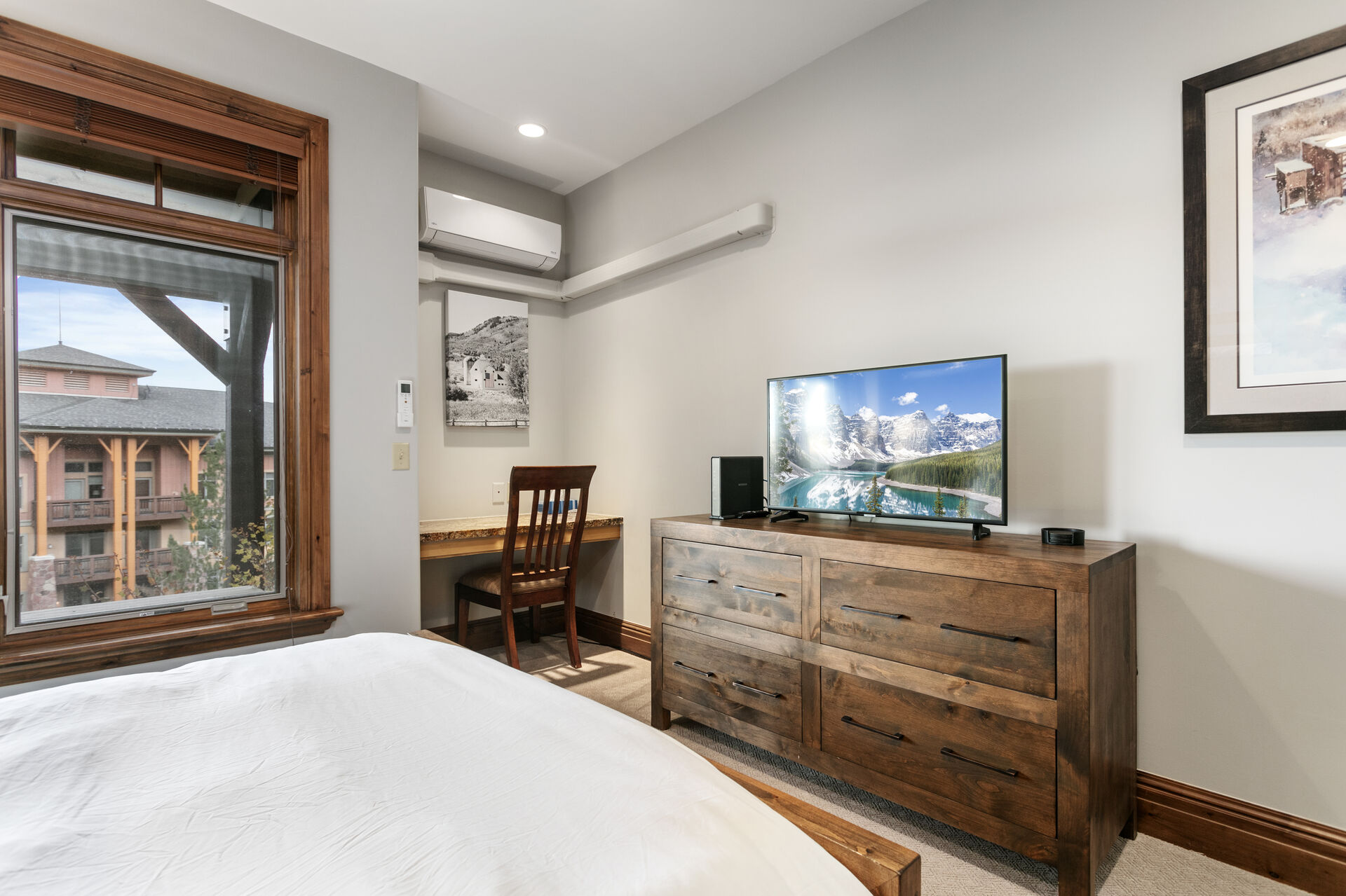 Guest bunkroom bedroom with Smart TV on top of dresser