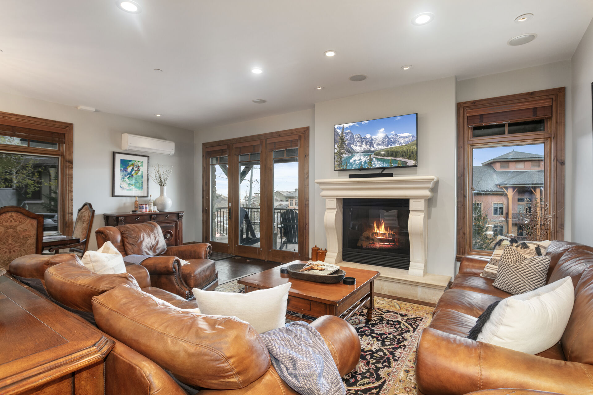Relaxing living room with TV and fireplace, surround sound speakers and outdoor porch with views!