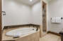 Master bedroom ensuite bathroom with soaking tub and separate shower