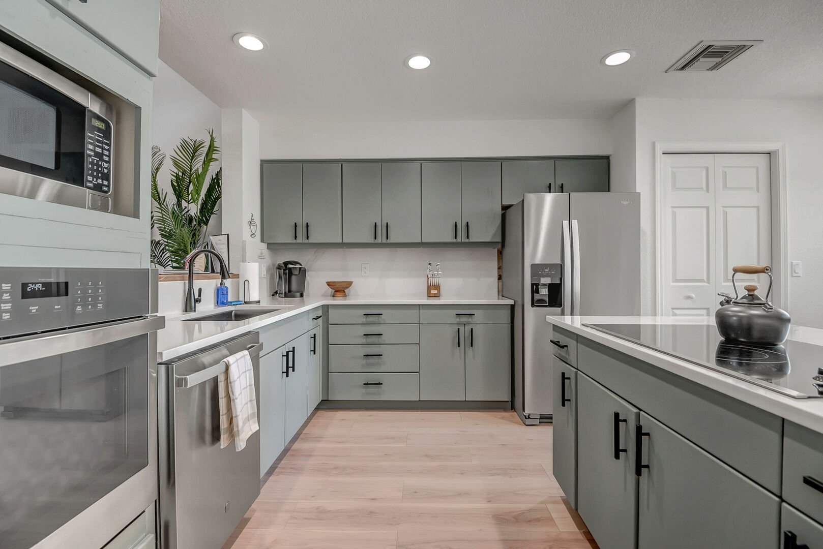 Fully remodeled kitchen is equipped with stainless steel appliances
