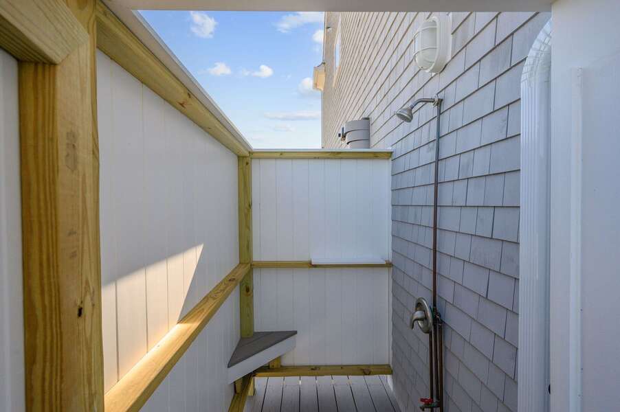 Enclosed outdoor shower on side of house