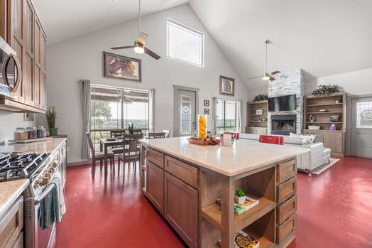 Fully Equipped Kitchen with Stainless Steel Appliances, including an Oversized Kitchen Island