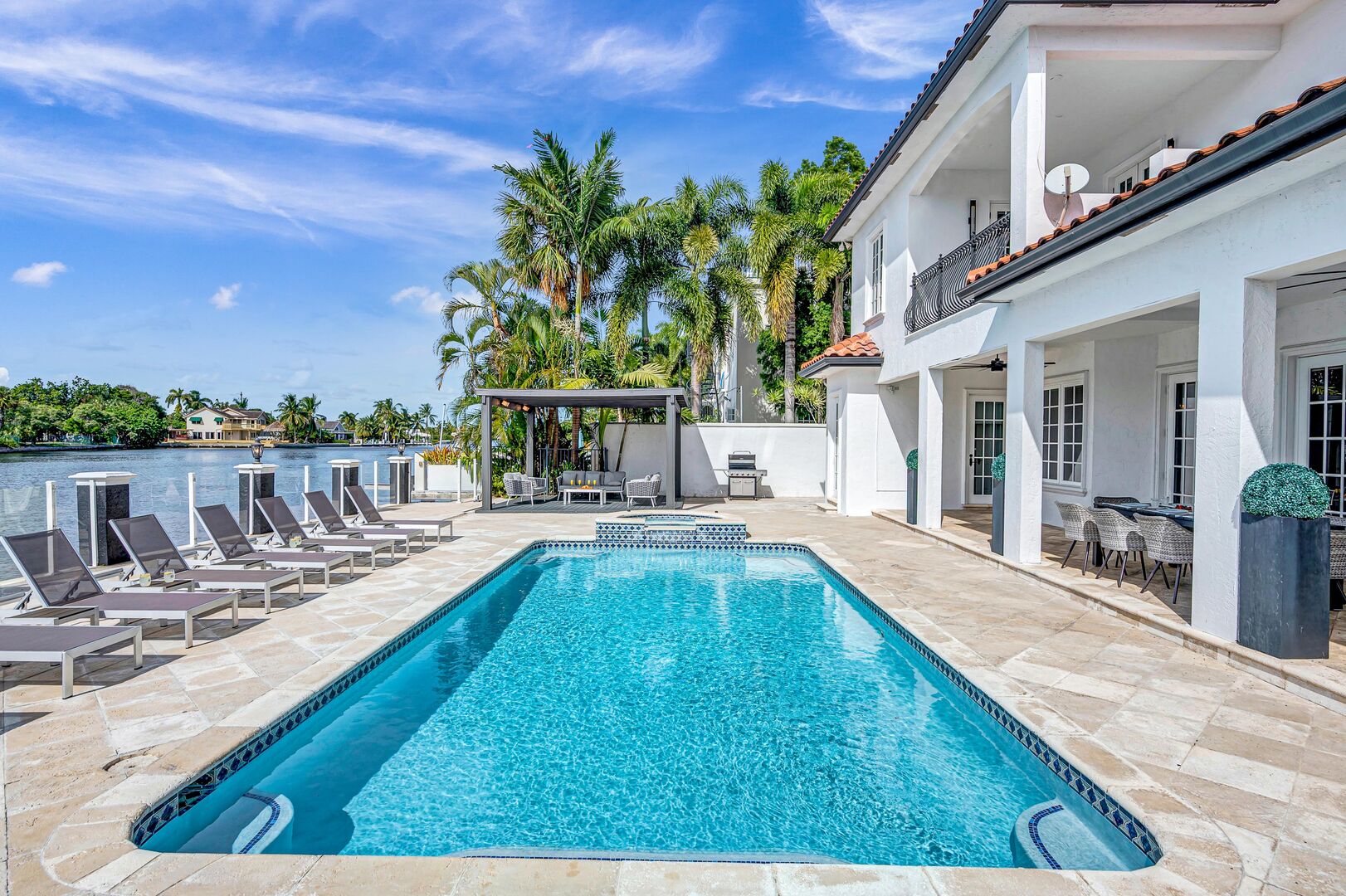 Relish in waterfront tranquility from the heated pool and lounge areas.