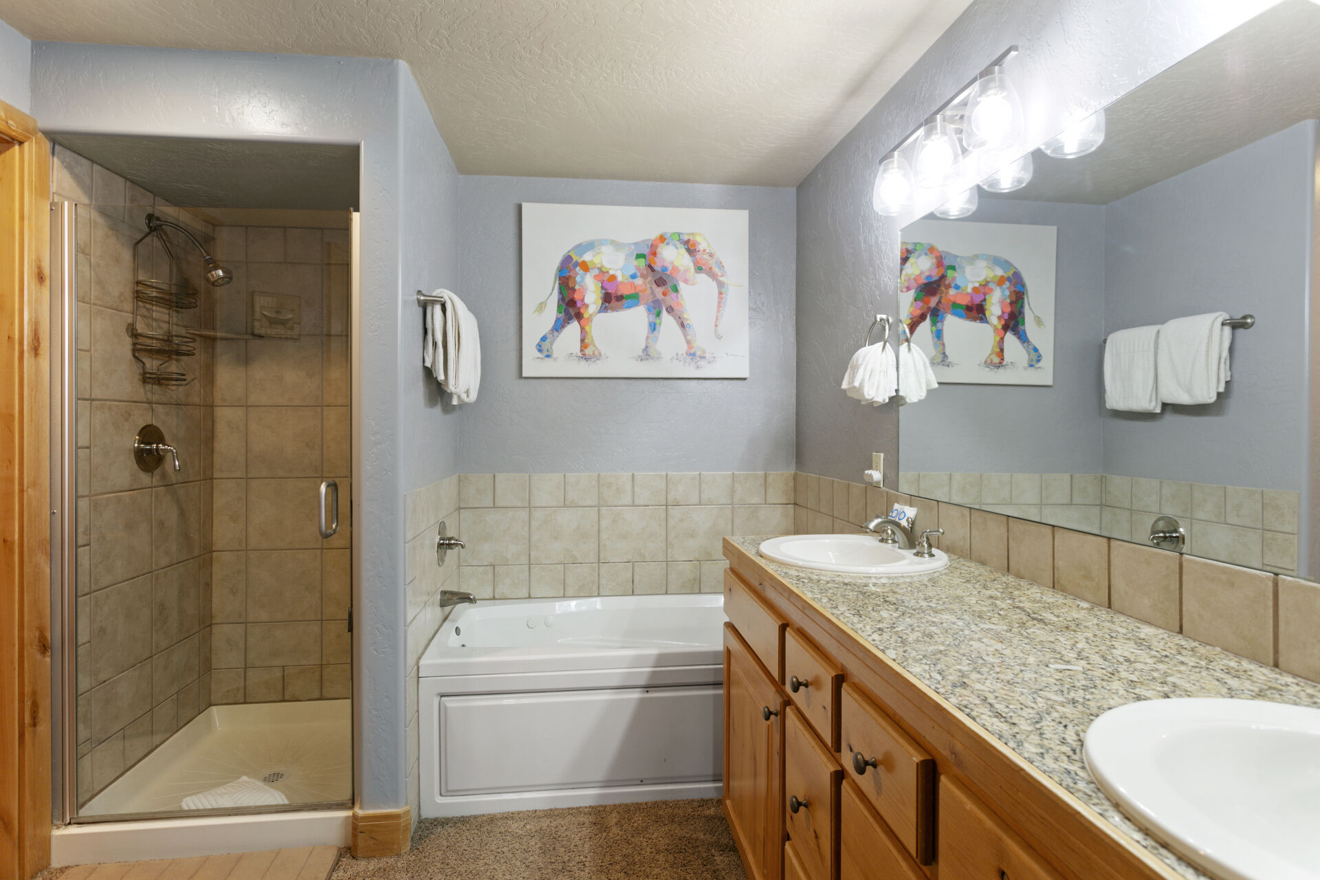 Master bedroom with ensuite bathroom, soaking tub, shower, closet and dual vanity sinks