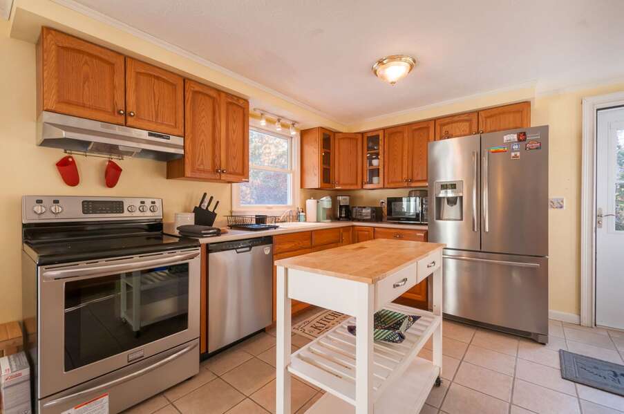Fully equipped kitchen that leads into the dining room.