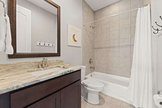 Guest bathroom with a combo shower/tub