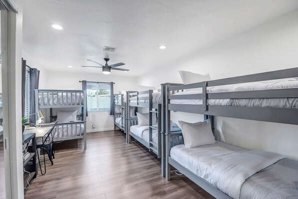 Bedroom Four/Bunk Room with Four Twin over Twin Bunk Beds and Desk Area