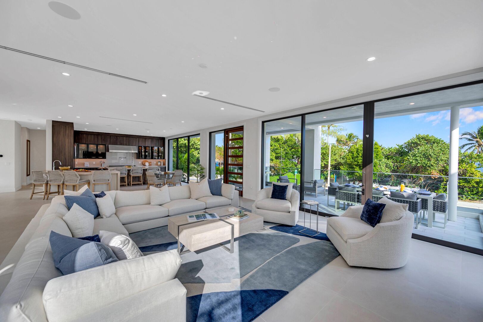 Open plan expansive and serene living area with a chef's kitchen, breakfast nook, wet bar boasting Ocean View through floor to ceiling windows.