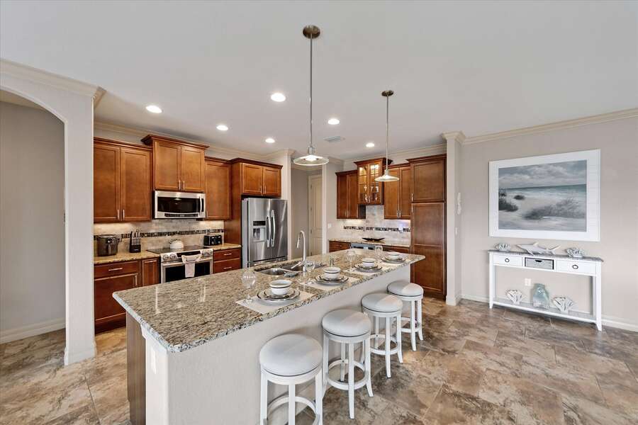 Open, fully-equipped kitchen. Kitchen island seats 4