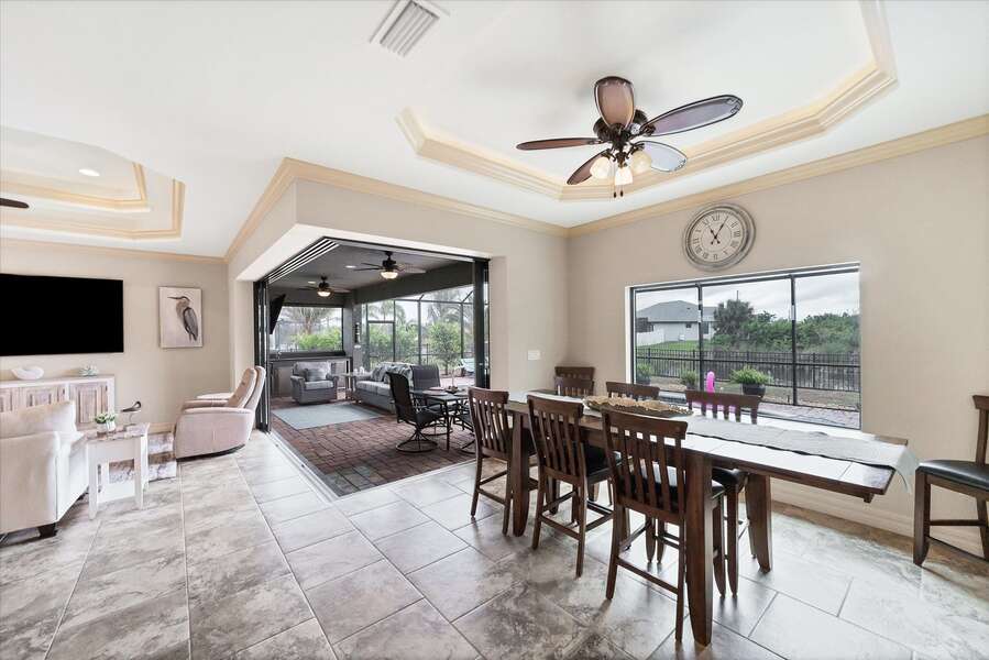 Dining area overlooking pool & canal. Dining table seats 8