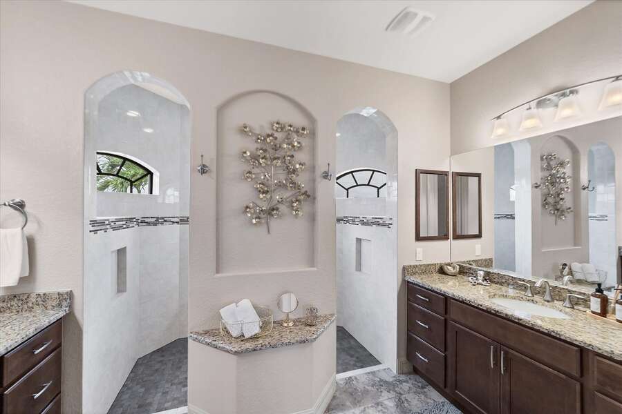 Primary bathroom with with walk-in shower and double vanities