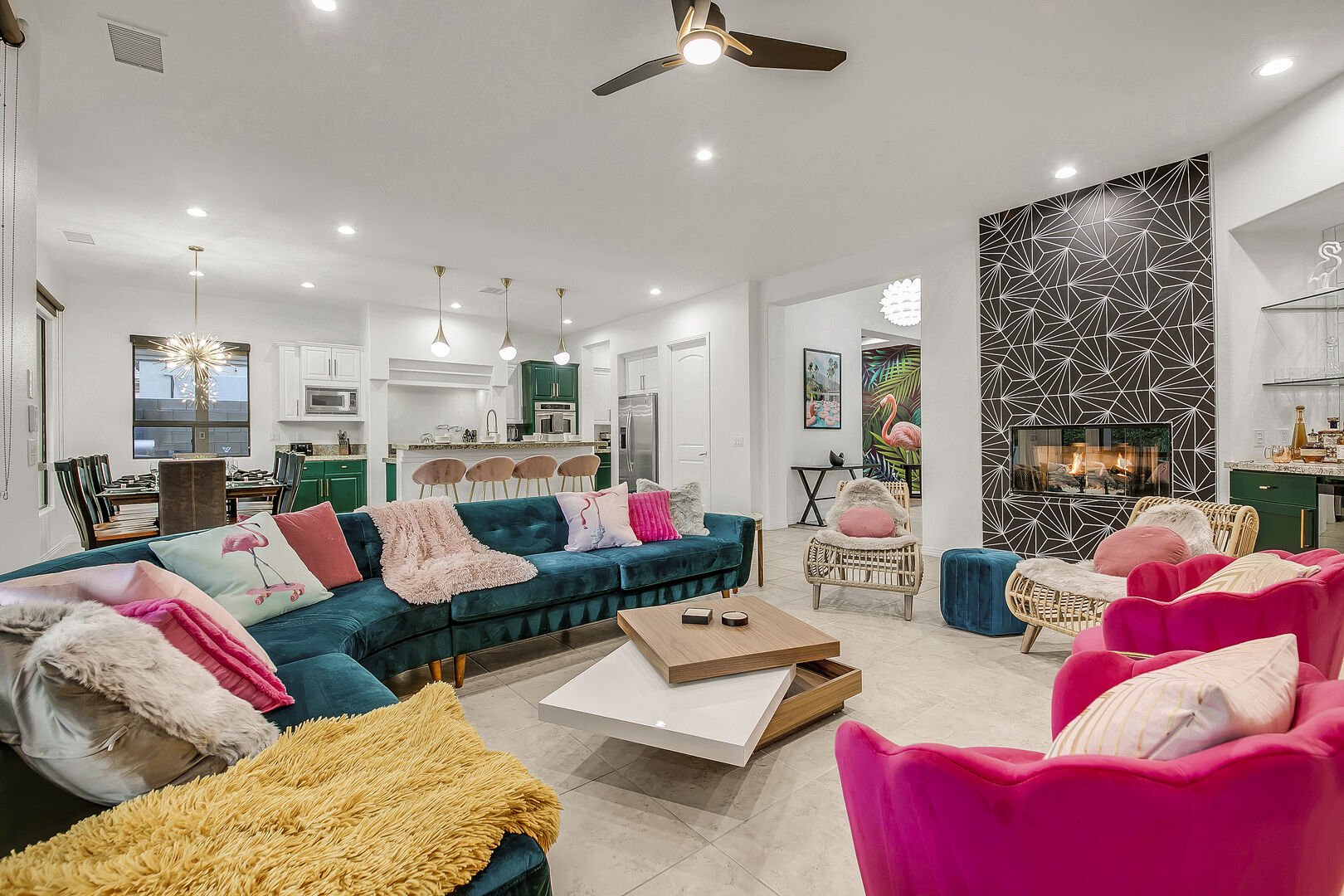 Enjoy the family room which seats 10 and features a cozy fire place, wine cooler, record player, books, and a bar area perfect for you to show off your mixology skills.