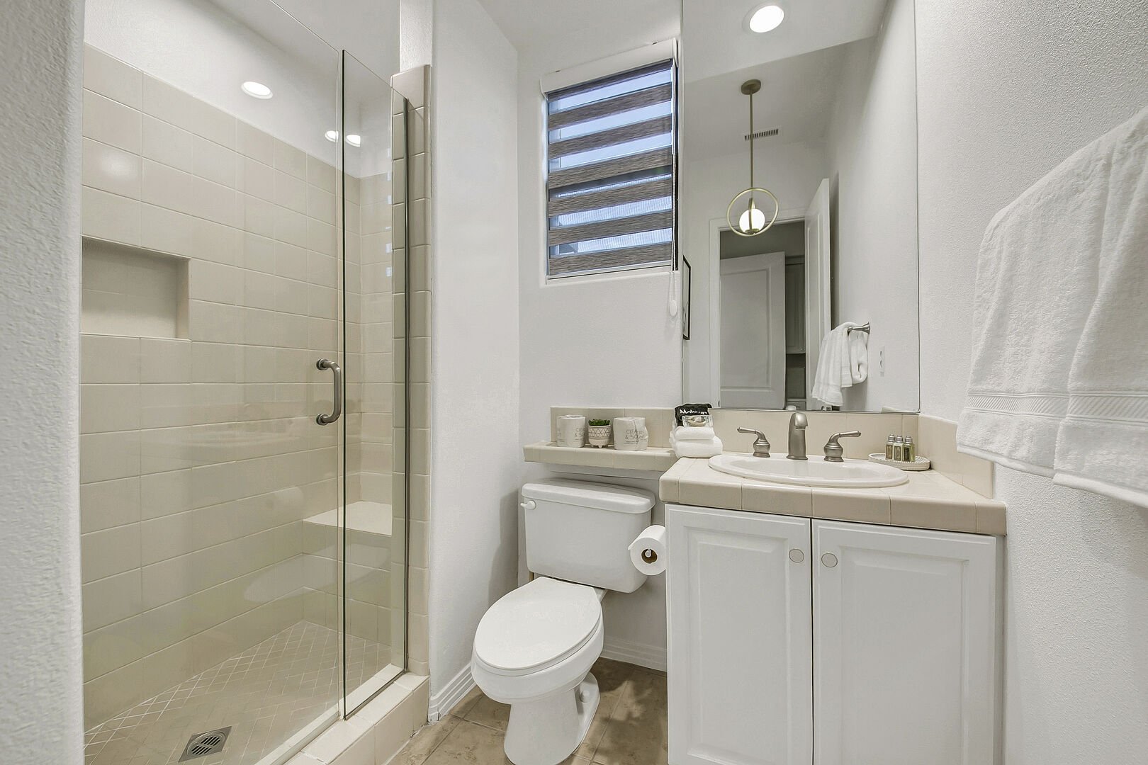The private en suite bathroom 2 features a tile shower and a vanity sink.